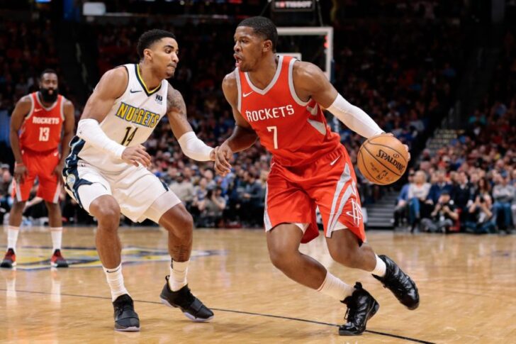 Denver Nuggets guard Gary Harris (14) guards Houston Rockets guard Joe Johnson (7) in the fourth quarter at the Pepsi Center.