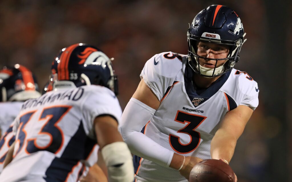 Drew Lock hands off to Muhammed. Credit: Aaron Doster, USA TODAY Sports.