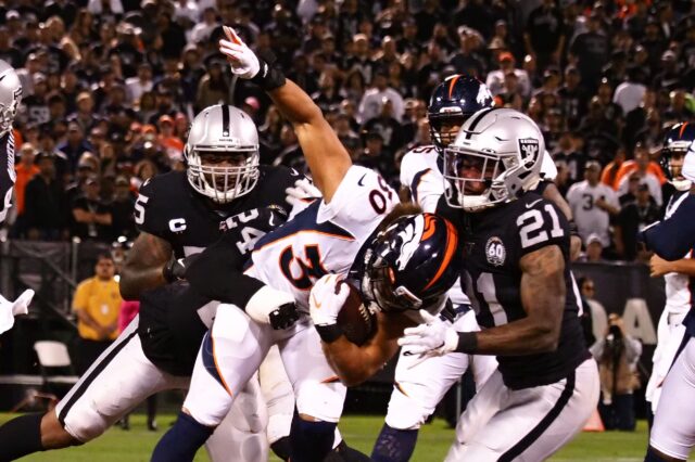 Phillip Lindsay tackled. Credit: Kelley L. Cox, USA TODAY Sports.