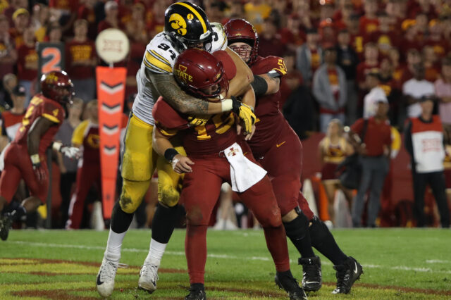 Iowa Hawkeyes defensive end A.J. Epenesa (94) pressures Iowa State Cyclones quarterback Brock Purdy (15) at Jack Trice Stadium. Iowa beat Iowa State 18-17.