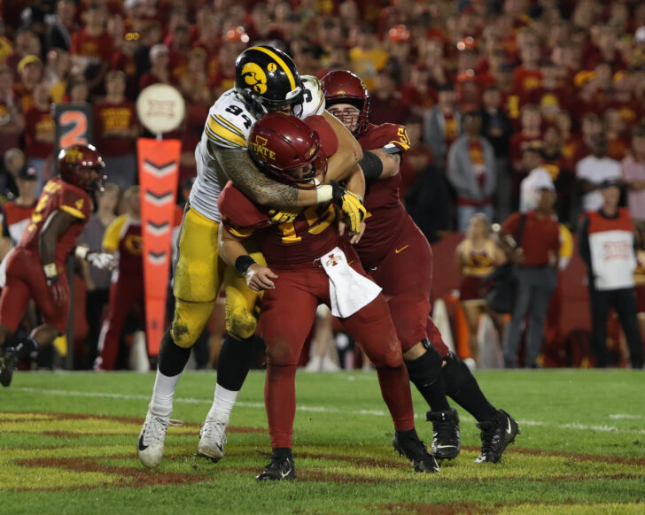 Iowa Hawkeyes defensive end A.J. Epenesa (94) pressures Iowa State Cyclones quarterback Brock Purdy (15) at Jack Trice Stadium. Iowa beat Iowa State 18-17.