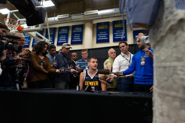 Denver Nuggets center Nikola Jokic (15) addresses questions during media day at the Pepsi Center.