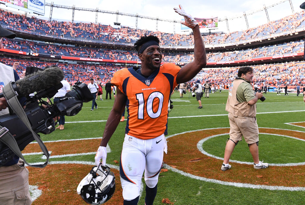 Denver Broncos wide receiver Emmanuel Sanders (10) celebrates the win over the Oakland Raiders at Broncos Stadium at Mile High.