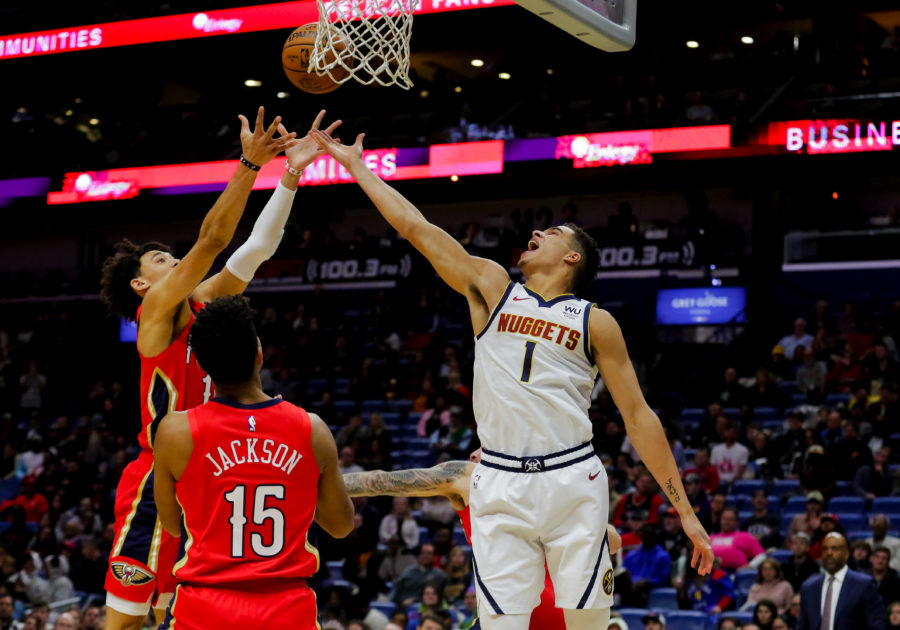 New Orleans Pelicans center Jaxson Hayes (10) rebounds over Denver Nuggets forward Michael Porter Jr. (1) during the first quarter at the Smoothie King Center.