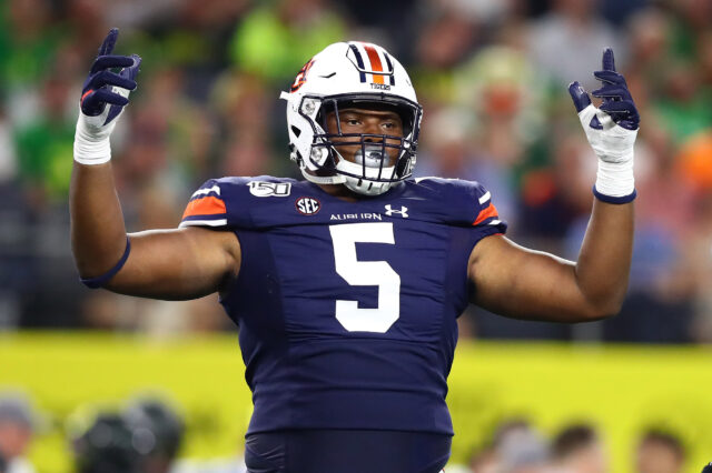 Auburn Tigers defensive tackle Derrick Brown (5) raises his arms during the game against the Oregon Ducks at AT&T Stadium.