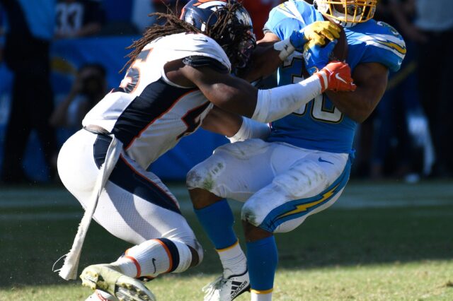 Denver Broncos linebacker A.J. Johnson (45) stops Los Angeles Chargers running back Austin Ekeler (30) after a short gain in the 4th quarter at Dignity Health Sports Park.