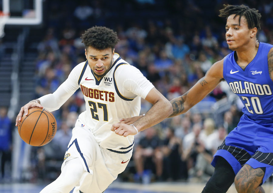 Denver Nuggets guard Jamal Murray (27) drives around Orlando Magic guard Markelle Fultz (20) during the second half at Amway Center