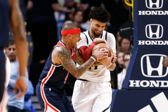 Denver Nuggets guard Jamal Murray (27) and Washington Wizards guard Isaiah Thomas (4) battle for the ball in the second quarter at the Pepsi Center.