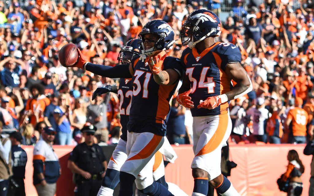 Justin Simmons celebrates his interception in the game against Tennessee. Credit: Ron Chenoy, USA TODAY Sports.