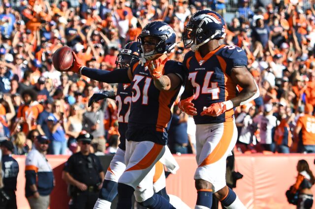 Justin Simmons celebrates his interception in the game against Tennessee. Credit: Ron Chenoy, USA TODAY Sports.