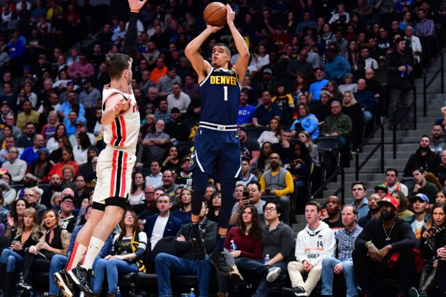 Denver Nuggets forward Michael Porter Jr. (1) attempts a basket over Portland Trail Blazers forward Mario Hezonja (44) in the second quarter at the Pepsi Center.