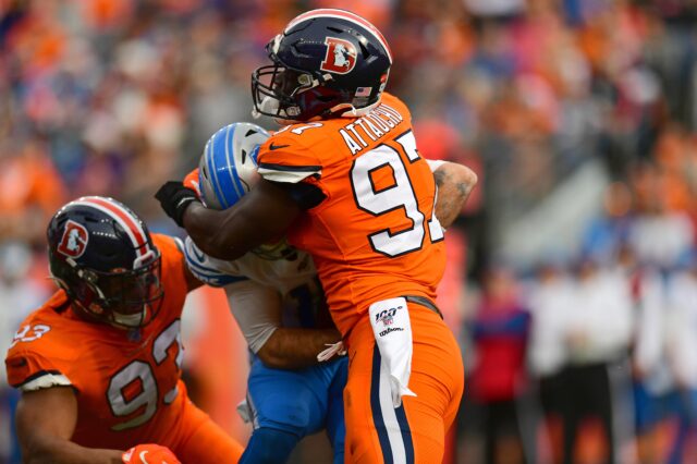 Dre'Mont Jones (93) earns his half a sack against David Blough of the Detroit Lions. Credit: Ron Chenoy, USA TODAY Sports.