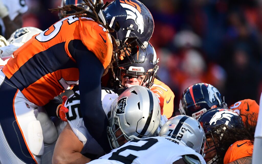 Alexander Johnson and Broncos teammates stop Ingold from scoring, the turning point of Denver's win. Credit: Ron Chenoy, USA TODAY Sports.