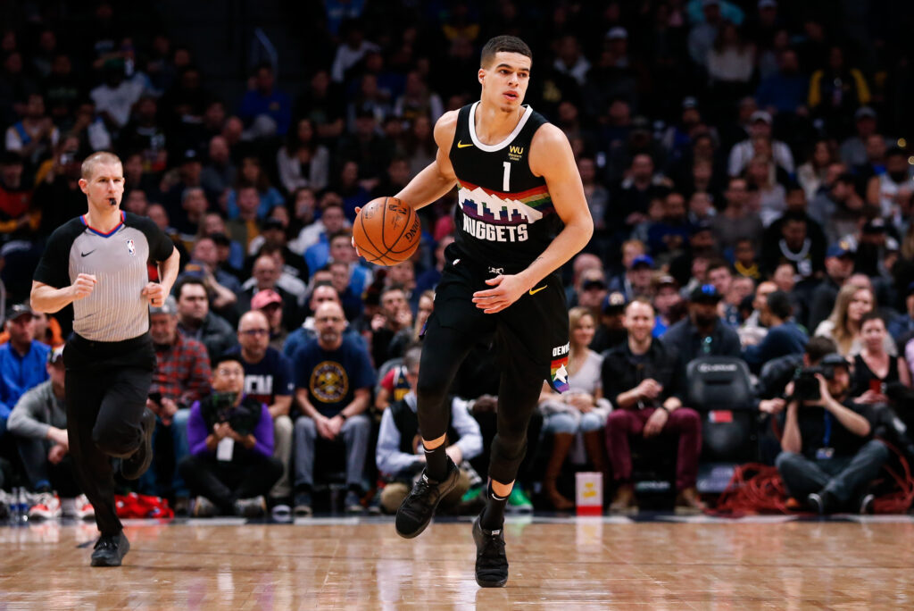 Denver Nuggets forward Michael Porter Jr. (1) dribbles the ball up court in the first quarter against the Sacramento Kings at the Pepsi Center.