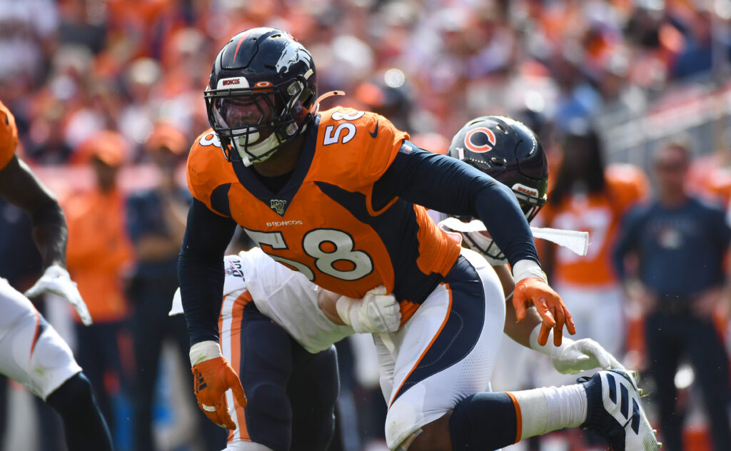 Denver Broncos outside linebacker Von Miller (58) pass rushes on the Chicago Bears in the first quarter at Empower Field at Mile High.