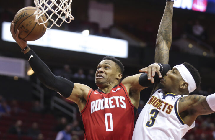 Houston Rockets guard Russell Westbrook (0) shoots against Denver Nuggets forward Torrey Craig (3) in the first quarter at Toyota Center.