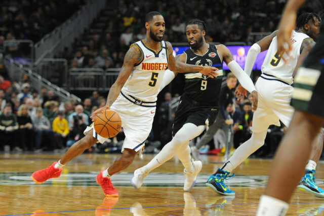 Denver Nuggets forward Will Barton (5) dribbles past Milwaukee Bucks Milwaukee Bucks guard Wesley Matthews (9) during the third quarter at Fiserv Forum.