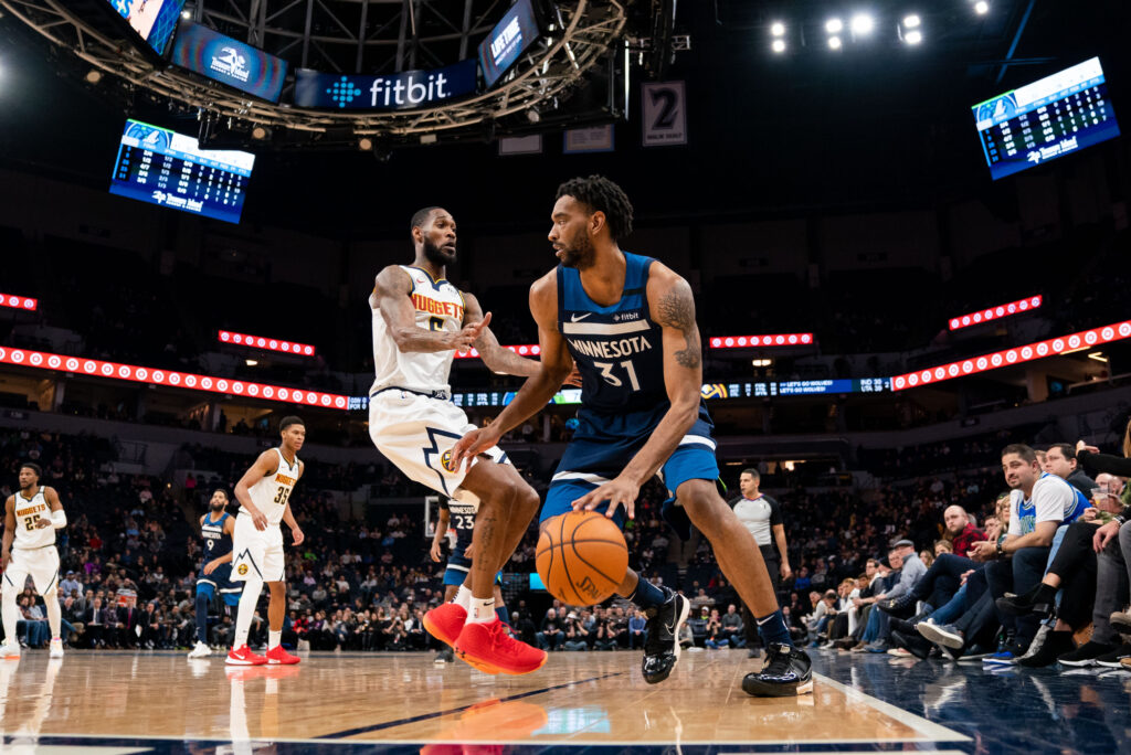 Minnesota Timberwolves forward Keita Bates-Diop (31) dribbles in the third quarter against Denver Nuggets guard Will Barton (5) at Target Center.