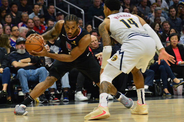 os Angeles Clippers forward Kawhi Leonard (2) controls the ball against Denver Nuggets guard Gary Harris (14) during the second half at Staples Center.