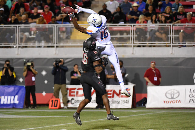 Boise State Broncos wide receiver John Hightower (16) reaches for the ball as UNLV Rebels linebacker Javin White (16) defends on the play during the second half at Sam Boyd Stadium.