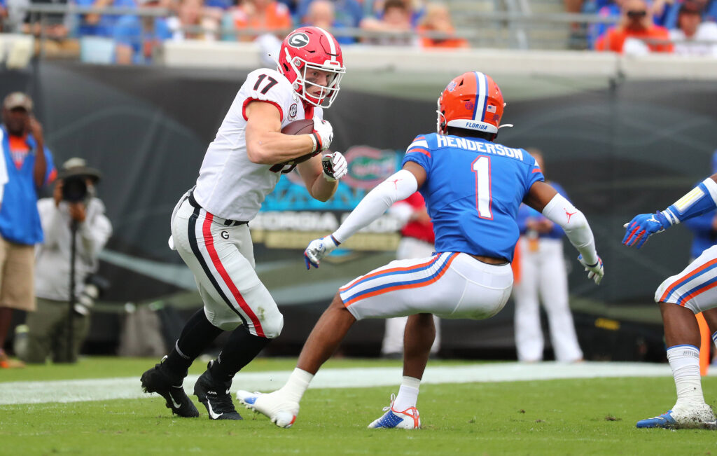 Georgia Bulldogs tight end Eli Wolf (17) runs the ball against Florida Gators defensive back CJ Henderson (1) during the first half at TIAA Bank Field.