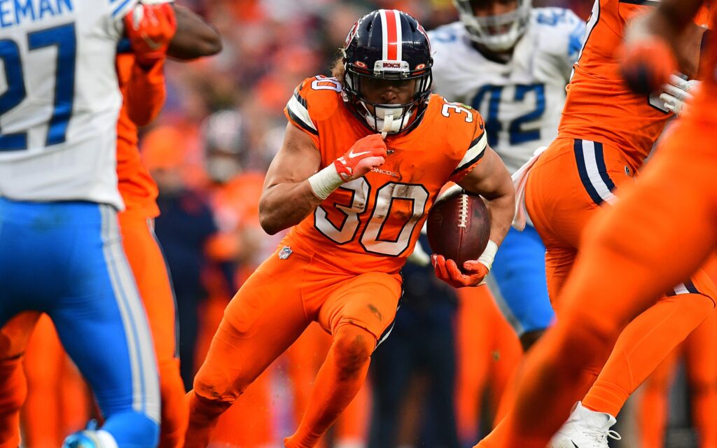 Phillip Lindsay runs between the tackles. Credit: Ron Chenoy, USA TODAY Sports.