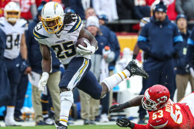 Melvin Gordon runs through a tackle. Credit: Anthony Hitchens, USA TODAY Sports.