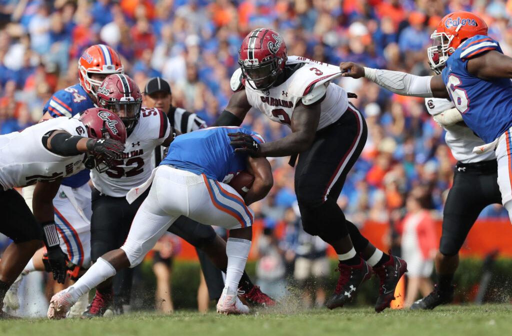 South Carolina Gamecocks defensive lineman Javon Kinlaw (3) tackles Florida Gators running back Dameon Pierce (27) during the second half at Ben Hill Griffin Stadium.