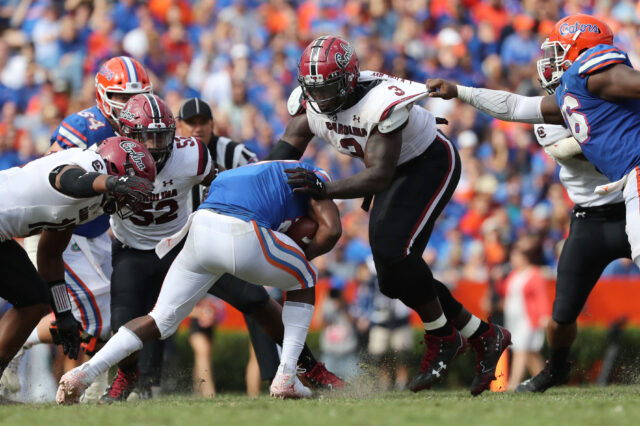 South Carolina Gamecocks defensive lineman Javon Kinlaw (3) tackles Florida Gators running back Dameon Pierce (27) during the second half at Ben Hill Griffin Stadium.