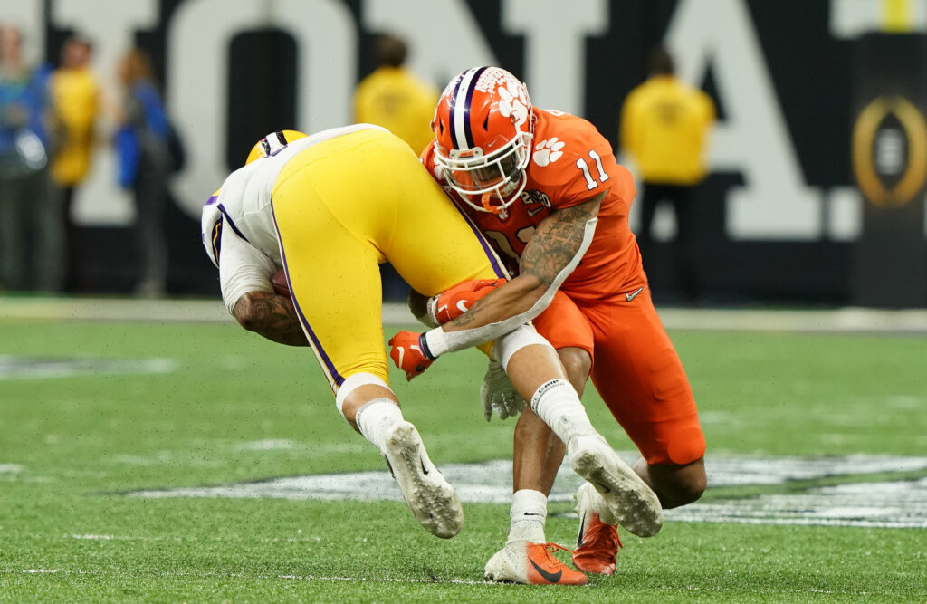 Clemson Tigers linebacker Isaiah Simmons (11) tackles LSU Tigers tight end Thaddeus Moss (81) in the first quarter in the College Football Playoff national championship game at Mercedes-Benz Superdome.