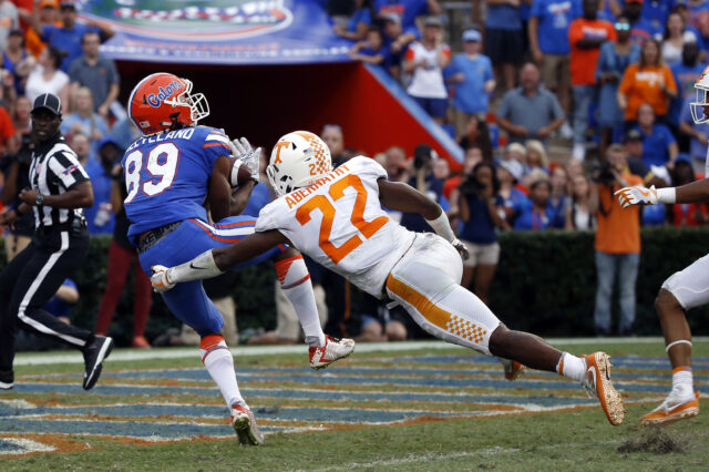 Florida Gators wide receiver Tyrie Cleveland (89) catches the ball for a touchdown as time expires to win the game as Tennessee Volunteers defensive back Micah Abernathy (22) attempted to defend during the second half at Ben Hill Griffin Stadium.