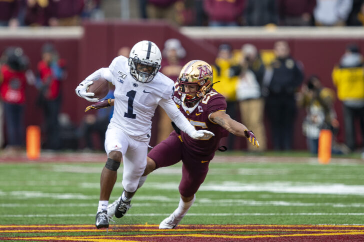 Penn State Nittany Lions wide receiver KJ Hamler (1) rushes with the ball after making a catch as Minnesota Golden Gophers defensive back Benjamin St-Juste (25) attempts to make a tackle in the first half at TCF Bank Stadium.