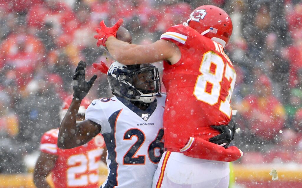 Yiadom makes a play on Travis Kelce. Credit: Denny Medley, USA TODAY Sports.