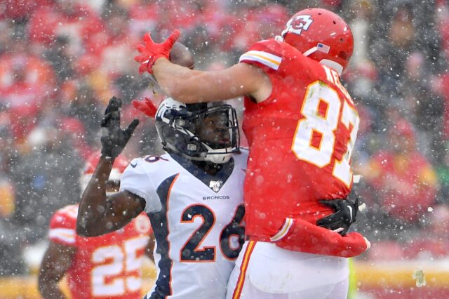 Yiadom makes a play on Travis Kelce. Credit: Denny Medley, USA TODAY Sports.