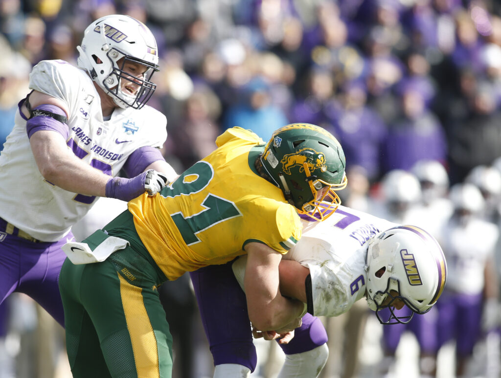 North Dakota State Bison defensive end Derrek Tuszka (91) sacks James Madison Dukes quarterback Ben DiNucci (6) in the fourth quarter at Toyota Stadium.