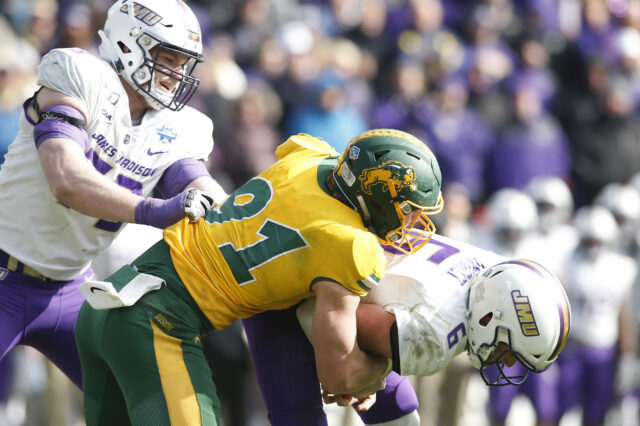 North Dakota State Bison defensive end Derrek Tuszka (91) sacks James Madison Dukes quarterback Ben DiNucci (6) in the fourth quarter at Toyota Stadium.