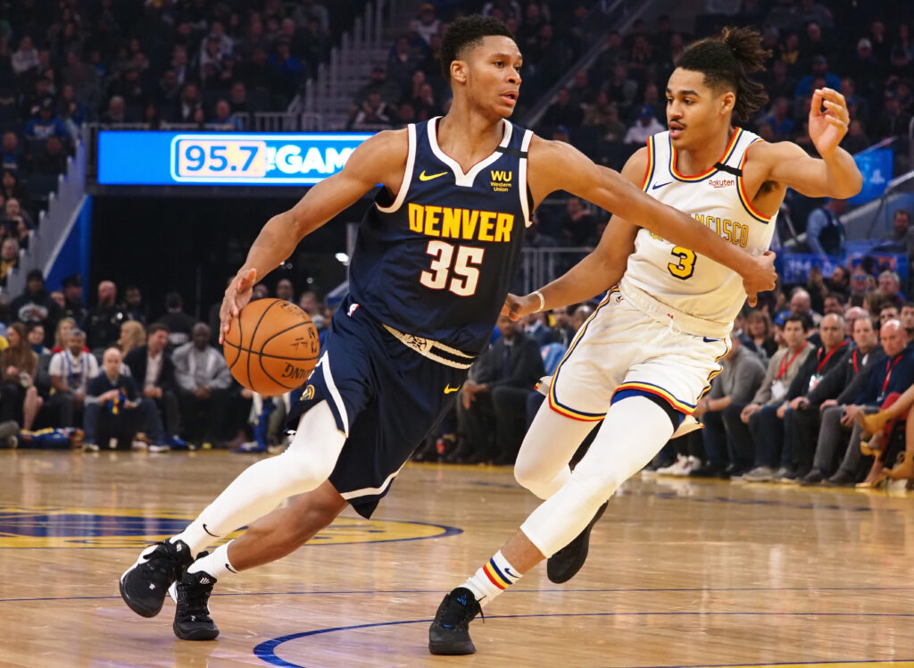 Denver Nuggets guard PJ Dozier (35) drives against Golden State Warriors guard Jordan Poole (3) during the first quarter at Chase Center.