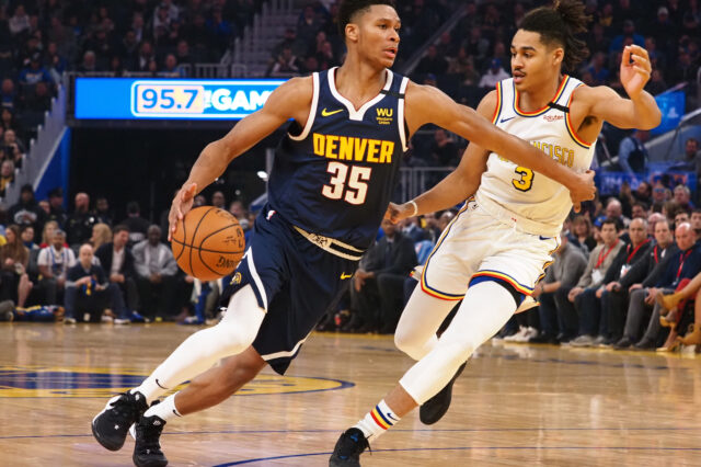 Denver Nuggets guard PJ Dozier (35) drives against Golden State Warriors guard Jordan Poole (3) during the first quarter at Chase Center.