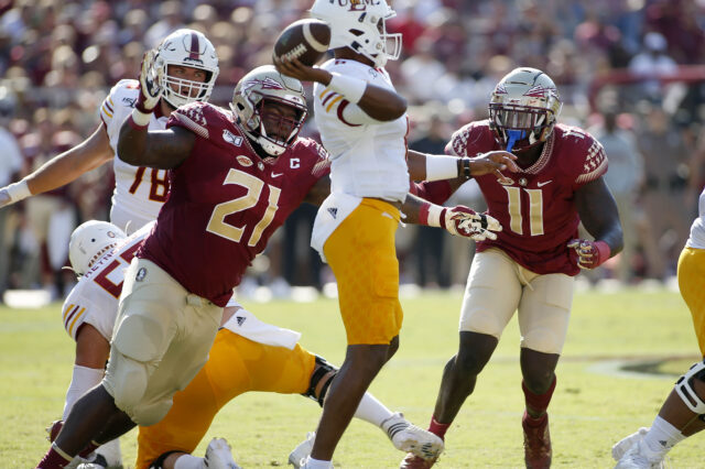 Florida State Seminoles defensive tackle Marvin Wilson (21) and Florida State Seminoles defensive end Janarius Robinson (11) pressure Louisiana Monroe Warhawks quarterback Caleb Evans (6)at Doak Campbell Stadium. Florida State is hosting the Louisiana Monroe Warhawks.