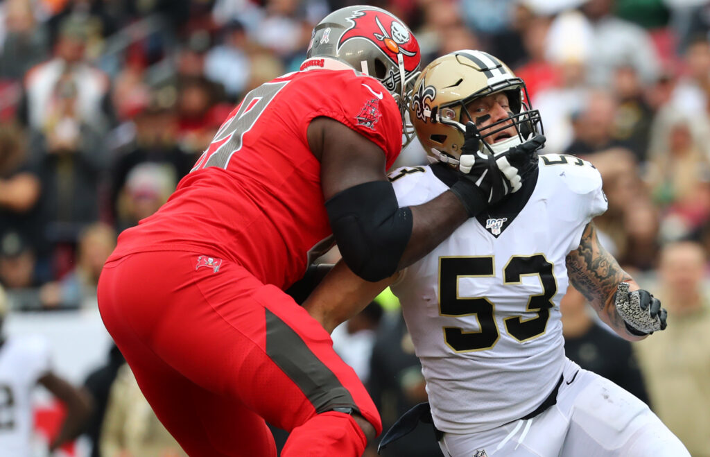 Tampa Bay Buccaneers offensive tackle Demar Dotson (69) blocks New Orleans Saints outside linebacker A.J. Klein (53) during the first half at Raymond James Stadium.