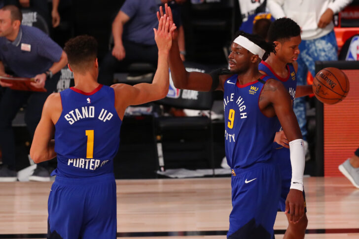 Denver Nuggets forward Michael Porter Jr. (1) and forward Jerami Grant (9) celebrate after defeating the San Antonio Spurs in a NBA basketball game at Visa Athletic Center.