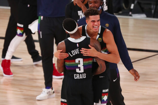 Denver Nuggets forward Torrey Craig (3) celebrates with forward Michael Porter Jr. (1) after defeating the Utah Jazz in game seven of the first round of the 2020 NBA Playoffs at ESPN Wide World of Sports Complex.