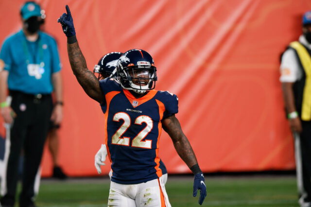 Denver Broncos strong safety Kareem Jackson (22) celebrates after a play in the fourth quarter against the Tennessee Titans at Empower Field at Mile High.