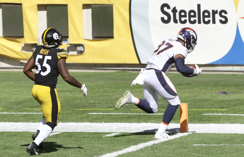 Denver Broncos tight end Noah Fant (87) scores a twenty yard touchdown behind Pittsburgh Steelers linebacker Devin Bush (55) during the third quarter at Heinz Field.