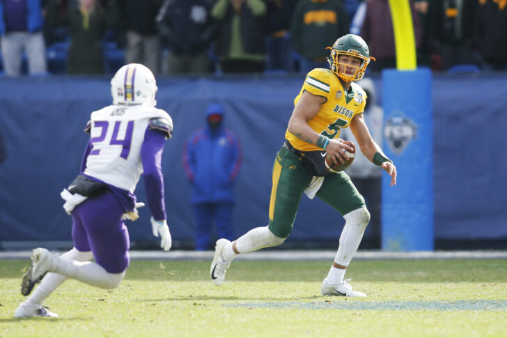 North Dakota State Bison quarterback Trey Lance (5) scrambles from James Madison Dukes safety D'Angelo Amos (24) in the third quarter at Toyota Stadium.