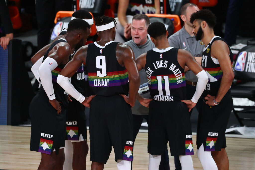 Denver Nuggets head coach Michael Malone talks with his team during a timeout during the second half against the Los Angeles Lakers in game four of the Western Conference Finals of the 2020 NBA Playoffs at AdventHealth Arena.