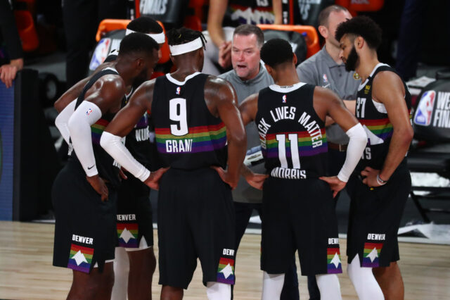 Denver Nuggets head coach Michael Malone talks with his team during a timeout during the second half against the Los Angeles Lakers in game four of the Western Conference Finals of the 2020 NBA Playoffs at AdventHealth Arena.