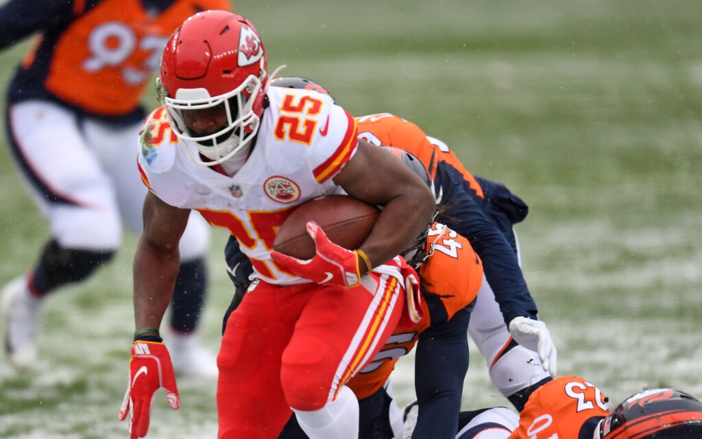 Three Broncos players bounce off Carlos Edwards-Helaire on Sunday. Credit: Ron Chenoy, USA TODAY Sports.