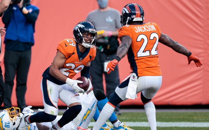 Nov 1, 2020; Denver, Colorado, USA; Denver Broncos cornerback Bryce Callahan (29) celebrates with strong safety Kareem Jackson (22) after intercepting a pass intended for Los Angeles Chargers wide receiver Mike Williams (81) in the third quarter at Empower Field at Mile High. Mandatory Credit: Isaiah J. Downing-USA TODAY Sports