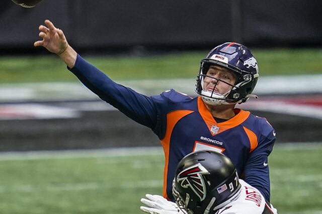 Drew Lock throws under pressure in Sunday's loss in Atlanta. Credit: Grady Jarrett, USA TODAY Sports.